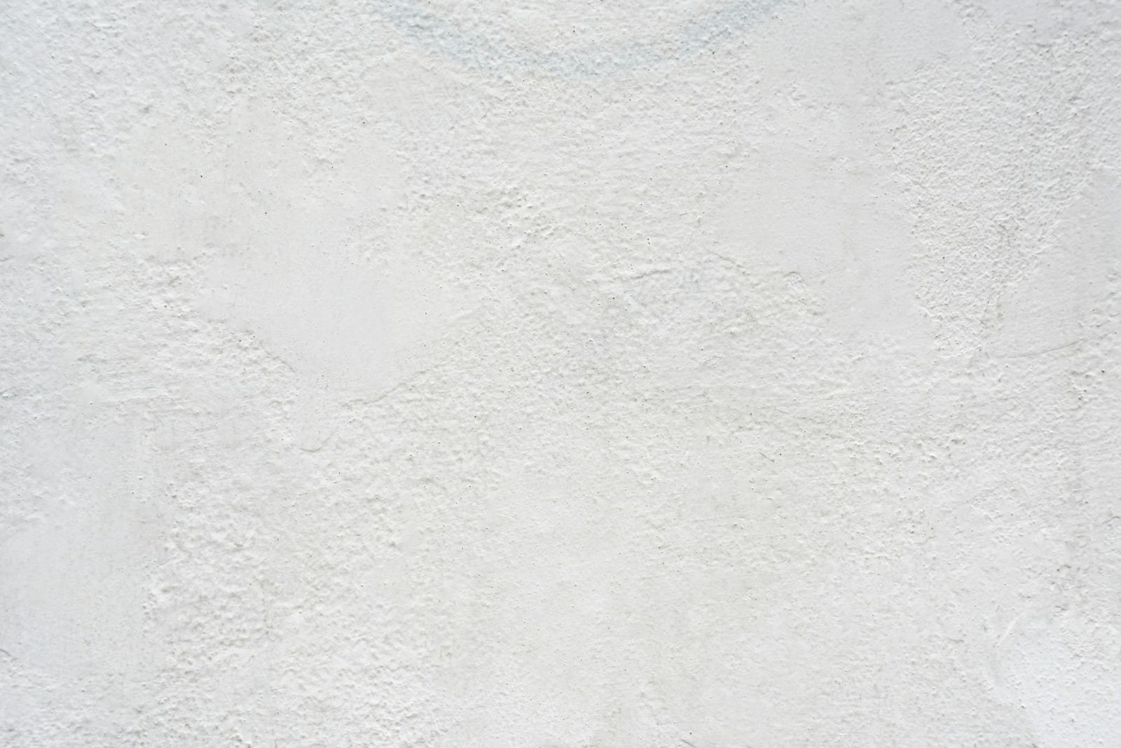 Soft light across a pale plaster wall